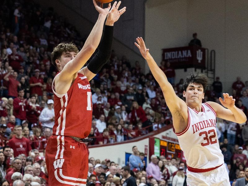 Jan 14, 2023; Bloomington, Indiana, USA; Wisconsin Badgers guard Max Klesmit (11) shoots the ball while Indiana Hoosiers guard Trey Galloway (32) defends in the second half at Simon Skjodt Assembly Hall. Mandatory Credit: Trevor Ruszkowski-USA TODAY Sports