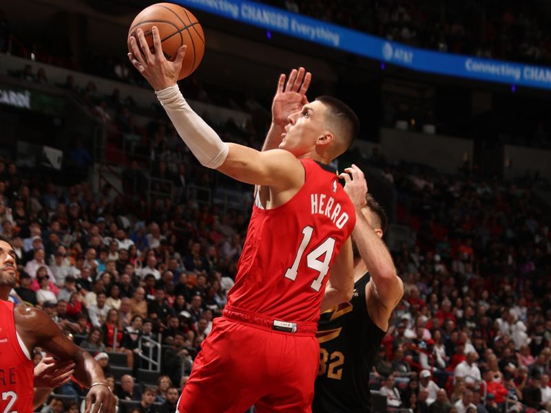 MIAMI, FL - DECEMBER 8: Tyler Herro #14 of the Miami Heat drives to the basket during the game against the Cleveland Cavaliers on December 8, 2024 at Kaseya Center in Miami, Florida. NOTE TO USER: User expressly acknowledges and agrees that, by downloading and or using this Photograph, user is consenting to the terms and conditions of the Getty Images License Agreement. Mandatory Copyright Notice: Copyright 2024 NBAE (Photo by Issac Baldizon/NBAE via Getty Images)