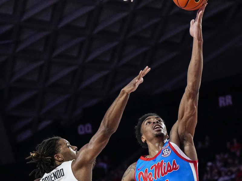 Feb 7, 2023; Athens, Georgia, USA; Mississippi Rebels forward Robert Allen (21) shoots at the basket over Georgia Bulldogs guard Kario Oquendo (3) during the first half at Stegeman Coliseum. Mandatory Credit: Dale Zanine-USA TODAY Sports