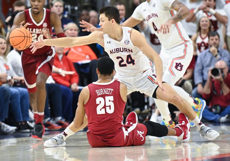 Feb 11, 2023; Auburn, Alabama, USA;  Alabama Crimson Tide forward Nimari Burnett (25) knocks the ball away from Auburn Tigers guard Lior Berman (24) at Neville Arena. Mandatory Credit: Julie Bennett-USA TODAY Sports

