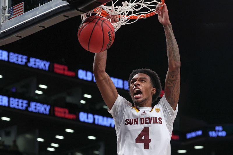 Nov 17, 2022; Brooklyn, New York, USA; Arizona State Sun Devils guard Desmond Cambridge Jr. (4) dunks the ball during the second half against the Michigan Wolverines at Barclays Center. Mandatory Credit: Vincent Carchietta-USA TODAY Sports