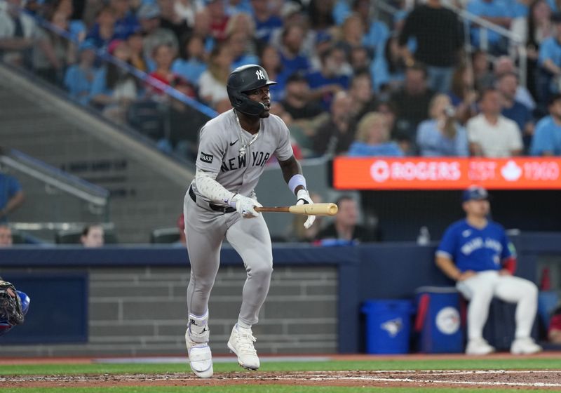 Jun 30, 2025; Toronto, Ontario, CAN; New York Yankees third baseman Jazz Chisholm Jr. (13) reacts after hitting a two-run home run against the Toronto Blue Jays during the fourth inning at Rogers Centre. Mandatory Credit: Nick Turchiaro-Imagn Images