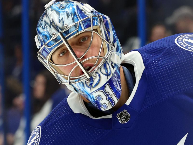 Jan 27, 2024; Tampa, Florida, USA; Tampa Bay Lightning goaltender Jonas Johansson (31) warms up prior to the game against the New Jersey Devils at Amalie Arena. Mandatory Credit: Kim Klement Neitzel-USA TODAY Sports