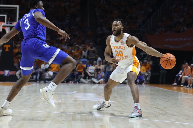 Mar 9, 2024; Knoxville, Tennessee, USA; Tennessee Volunteers guard Josiah-Jordan James (30) passes the ball against the Kentucky Wildcats during the second half at Thompson-Boling Arena at Food City Center. Mandatory Credit: Randy Sartin-USA TODAY Sports