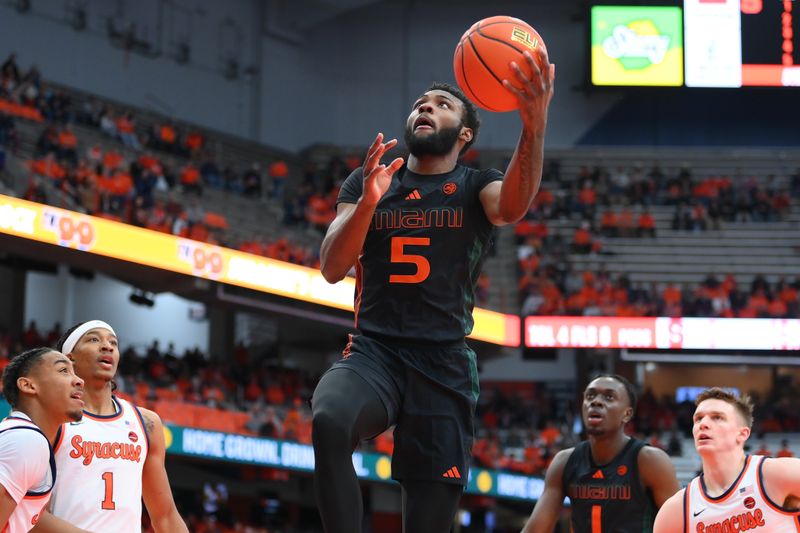 Jan 20, 2024; Syracuse, New York, USA; Miami (Fl) Hurricanes guard Wooga Poplar (5) drives fior a shot against the Syracuse Orange during the first half at the JMA Wireless Dome. Mandatory Credit: Rich Barnes-USA TODAY Sports