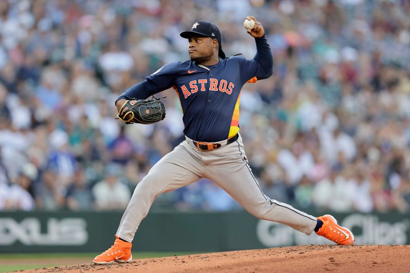 Jul 20, 2024; Seattle, Washington, USA; Houston Astros starting pitcher Framber Valdez (59) throws against the Seattle Mariners during the second inning at T-Mobile Park. Mandatory Credit: John Froschauer-USA TODAY Sports