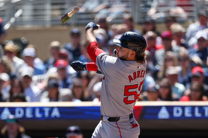 May 5, 2024; Minneapolis, Minnesota, USA; Boston Red Sox Wilyer Abreu (52) loses control of his bat during the second inning against the Minnesota Twins at Target Field. Mandatory Credit: Matt Krohn-USA TODAY Sports