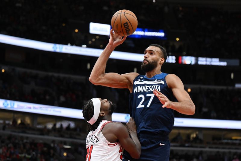 CHICAGO, ILLINOIS - MARCH 17: Rudy Gobert #27 of the Minnesota Timberwolves against Patrick Beverley #21 of the Chicago Bulls at United Center on March 17, 2023 in Chicago, Illinois.  NOTE TO USER: User expressly acknowledges and agrees that, by downloading and or using this photograph, User is consenting to the terms and conditions of the Getty Images License Agreement.  (Photo by Quinn Harris/Getty Images)