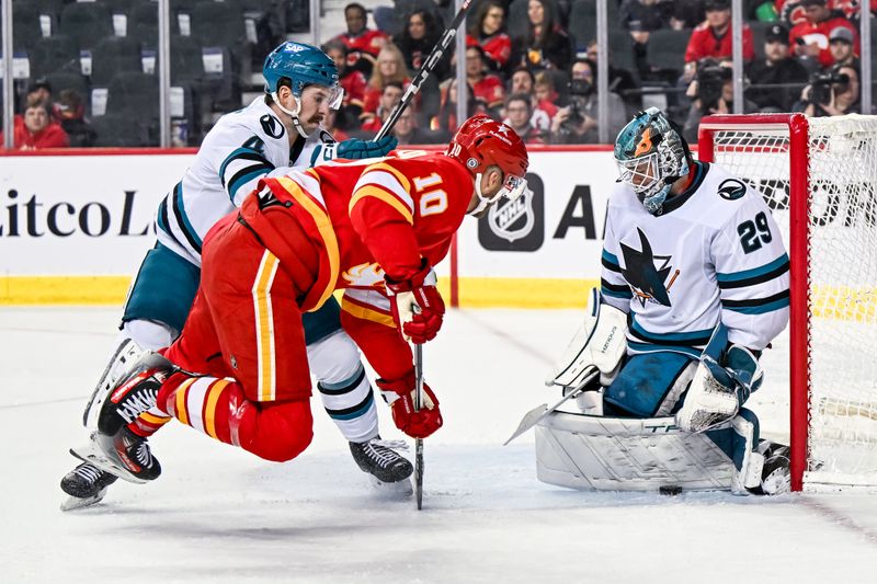 Feb 15, 2024; Calgary, Alberta, CAN; San Jose Sharks goaltender Mackenzie Blackwood (29) stops Calgary Flames center Jonathan Huberdeau (10) during the third period at Scotiabank Saddledome. Mandatory Credit: Brett Holmes-USA TODAY Sports