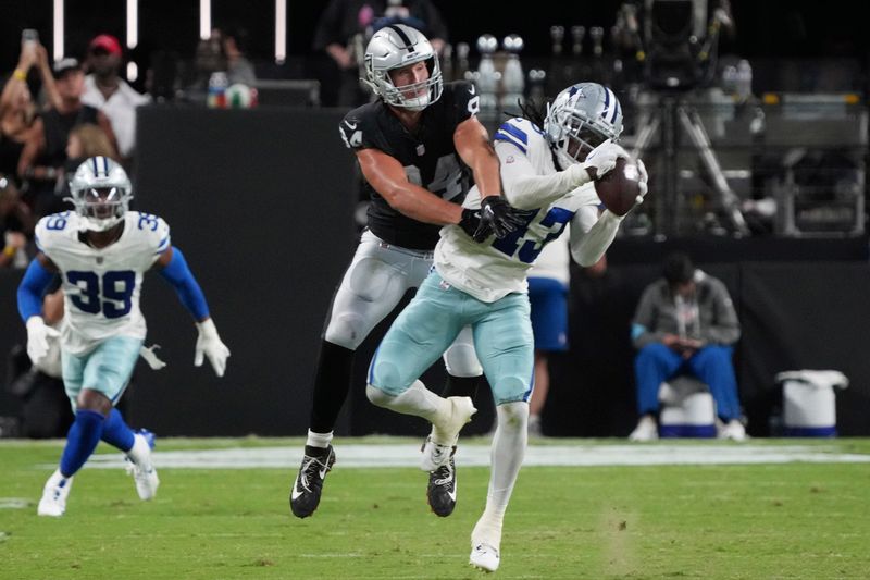 Dallas Cowboys cornerback Kemon Hall (43) intercepts a pass intended for Las Vegas Raiders tight end Harrison Bryant (84) during the second half of an NFL preseason football game, Saturday, Aug. 17, 2024, in Las Vegas. (AP Photo/Rick Scuteri)