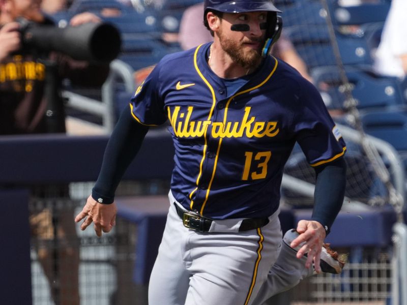 Feb 24, 2024; Peoria, Arizona, USA; Milwaukee Brewers catcher Eric Haase (13) rounds third base and scores a run against the San Diego Padres during the second inning of a Spring Training game at Peoria Sports Complex. Mandatory Credit: Joe Camporeale-USA TODAY Sports