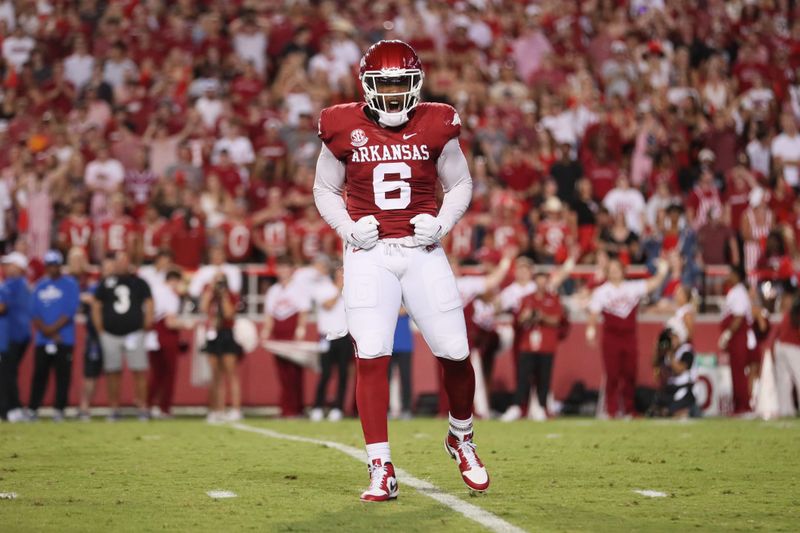 Sep 16, 2023; Fayetteville, Arkansas, USA; Arkansas Razorbacks defensive lineman John Morgan III (6) celebrates after forcing a fumble in the second quarter against the BYU Cougars at Donald W. Reynolds Razorback Stadium. Mandatory Credit: Nelson Chenault-USA TODAY Sports