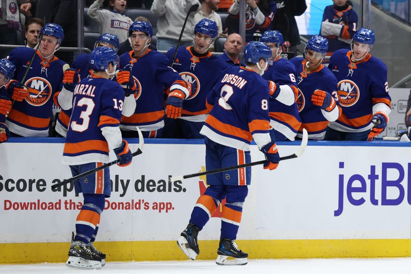 Jan 18, 2025; Elmont, New York, USA; New York Islanders defenseman Noah Dobson (8) celebrates his goal against the San Jose Sharks during the second period at UBS Arena. Mandatory Credit: Thomas Salus-Imagn Images