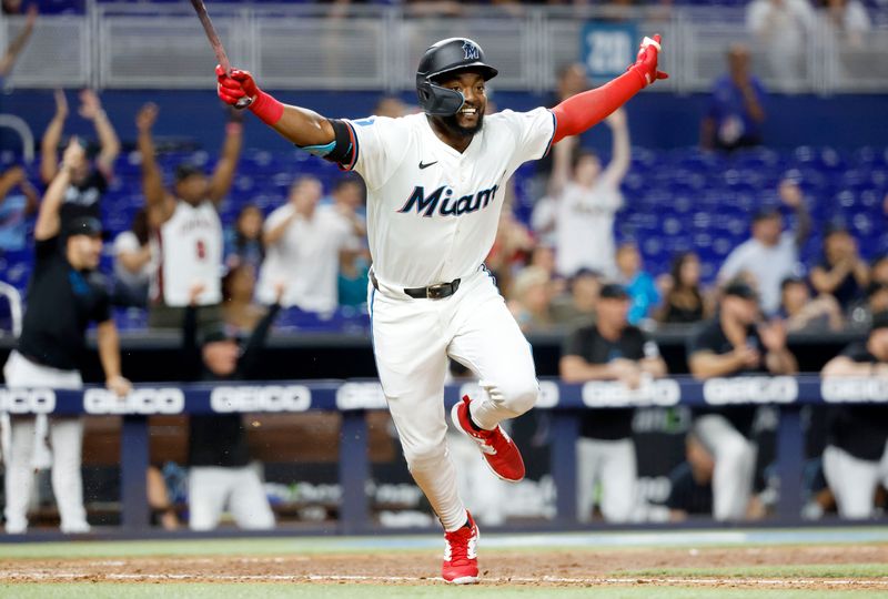 Jun 18, 2024; Miami, Florida, USA; Miami Marlins shortstop Vidal Brujan (17) reacts after singling in the winning run against the St. Louis Cardinals  after the tenth inning at loanDepot Park. Mandatory Credit: Rhona Wise-USA TODAY Sports