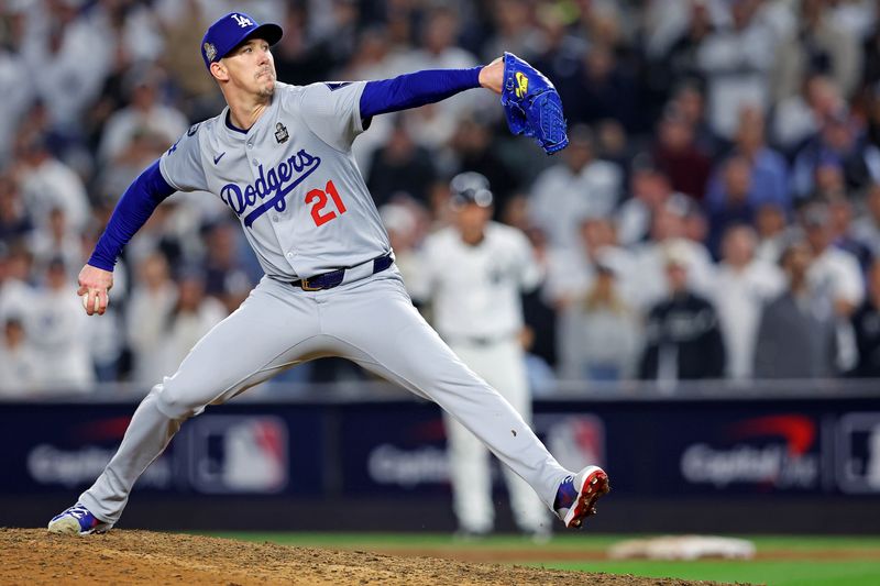 Oct 30, 2024; New York, New York, USA; Los Angeles Dodgers pitcher Walker Buehler (21) pitches during the ninth inning against the New York Yankees in game four of the 2024 MLB World Series at Yankee Stadium. Mandatory Credit: Brad Penner-Imagn Images