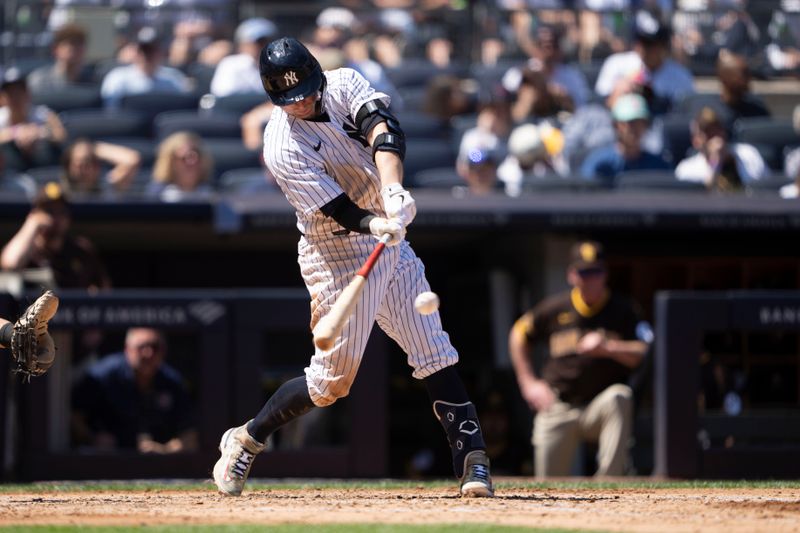 May 28, 2023; Bronx, New York, USA; New York Yankees catcher Kyle Higashioka (66) hits an RBI double against the San Diego Padres during the third inning at Yankee Stadium. Mandatory Credit: Gregory Fisher-USA TODAY Sports