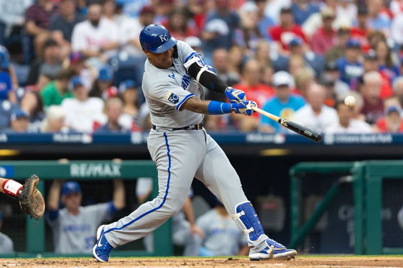 Aug 4, 2023; Philadelphia, Pennsylvania, USA; Kansas City Royals catcher Salvador Perez (13) hits a single during the second inning against the Philadelphia Phillies at Citizens Bank Park. Mandatory Credit: Bill Streicher-USA TODAY Sports