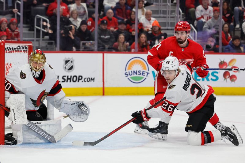 Jan 31, 2024; Detroit, Michigan, USA;  Detroit Red Wings center Dylan Larkin (71) and Ottawa Senators defenseman Erik Brannstrom (26) fight for position in front of goaltender Joonas Korpisalo (70) in the second period at Little Caesars Arena. Mandatory Credit: Rick Osentoski-USA TODAY Sports