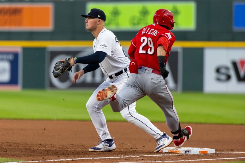 Sep 13, 2023; Detroit, Michigan, USA; Cincinnati Reds center fielder TJ Friedl (29) beats the throw to Detroit Tigers first baseman Spencer Torkelson (20) in the fourth inning at Comerica Park. Mandatory Credit: David Reginek-USA TODAY Sports