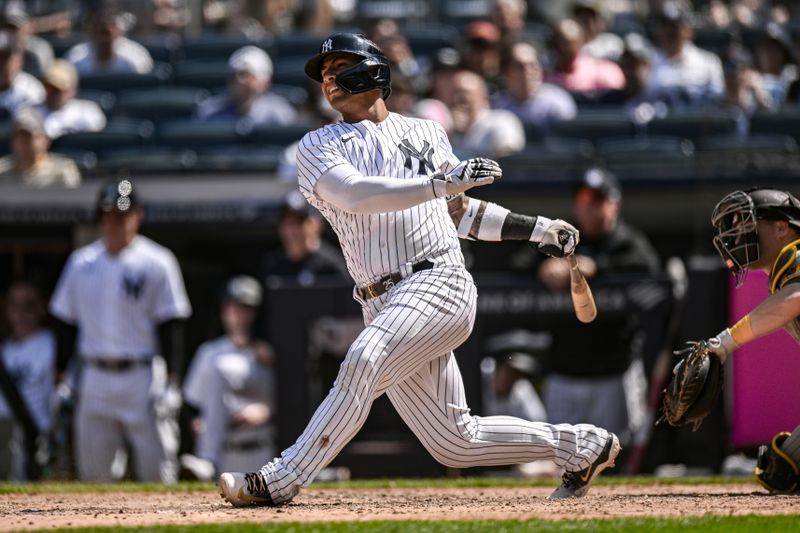 May 27, 2023; Bronx, New York, USA; New York Yankees second baseman Gleyber Torres (25) hits a single during the ninth inning against the San Diego Padres at Yankee Stadium. Mandatory Credit: John Jones-USA TODAY Sports