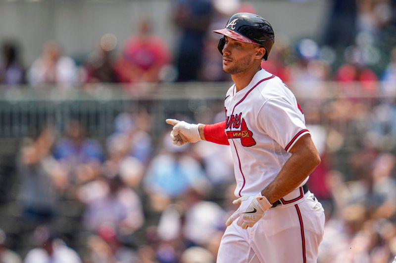 Jun 28, 2023; Cumberland, Georgia, USA; Atlanta Braves first baseman Matt Olson (28) reacts after hitting a home run against the Minnesota Twins during the eighth inning at Truist Park. Mandatory Credit: Dale Zanine-USA TODAY Sports