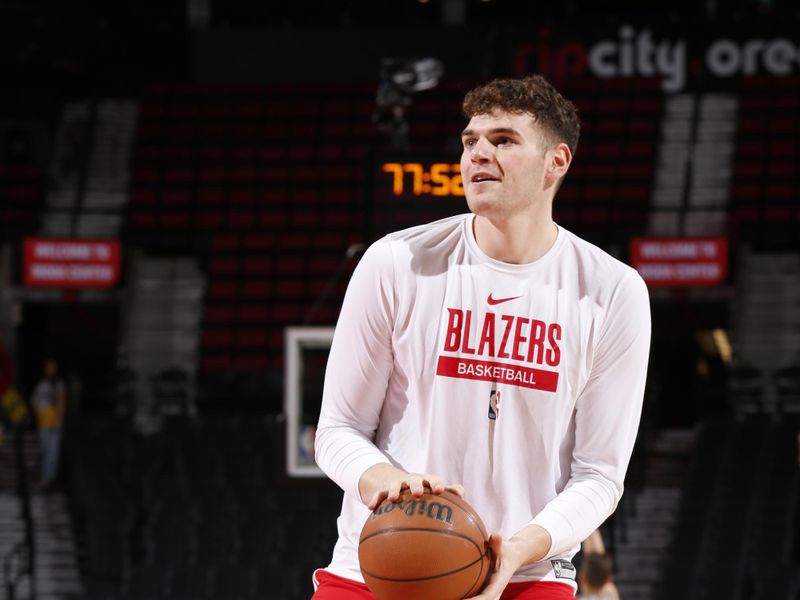 PORTLAND, OR - DECEMBER 1: Donovan Clingan #23 of the Portland Trail Blazers handles the ball before the game against the Dallas Mavericks on December 1, 2024 at the Moda Center Arena in Portland, Oregon. NOTE TO USER: User expressly acknowledges and agrees that, by downloading and or using this photograph, user is consenting to the terms and conditions of the Getty Images License Agreement. Mandatory Copyright Notice: Copyright 2024 NBAE (Photo by Cameron Browne/NBAE via Getty Images)