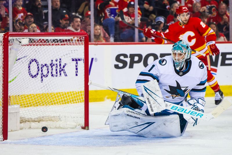 Apr 18, 2024; Calgary, Alberta, CAN; San Jose Sharks goaltender Devin Cooley (1) reacts to the goal by Calgary Flames center Kevin Rooney (not pictured) during the second period at Scotiabank Saddledome. Mandatory Credit: Sergei Belski-USA TODAY Sports