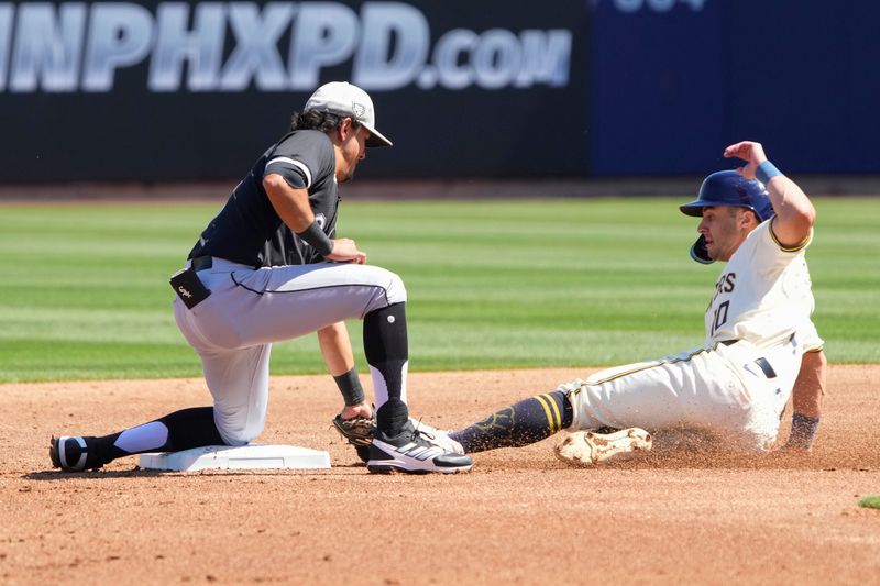 Mar 13, 2024; Phoenix, Arizona, USA; Chicago White Sox second baseman Nicky Lopez (8) tags out Milwaukee Brewers outfielder Sal Frelick (10) in the first inning at American Family Fields of Phoenix. Mandatory Credit: Rick Scuteri-USA TODAY Sports