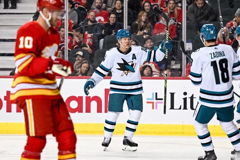 Feb 15, 2024; Calgary, Alberta, CAN; San Jose Sharks center Mikael Granlund (64) celebrates after scoring a goal against the Calgary Flames during the second period at Scotiabank Saddledome. Mandatory Credit: Brett Holmes-USA TODAY Sports