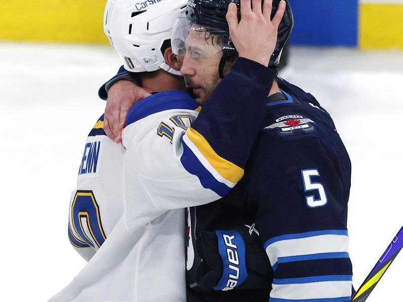 May 4, 2025; Winnipeg, Manitoba, CAN; St. Louis Blues center Brayden Schenn (10) and Winnipeg Jets defenseman Luke Schenn (5) react to the double overtime of game seven of the first round of the 2025 Stanley Cup Playoffs at Canada Life Centre. Mandatory Credit: James Carey Lauder-Imagn Images
