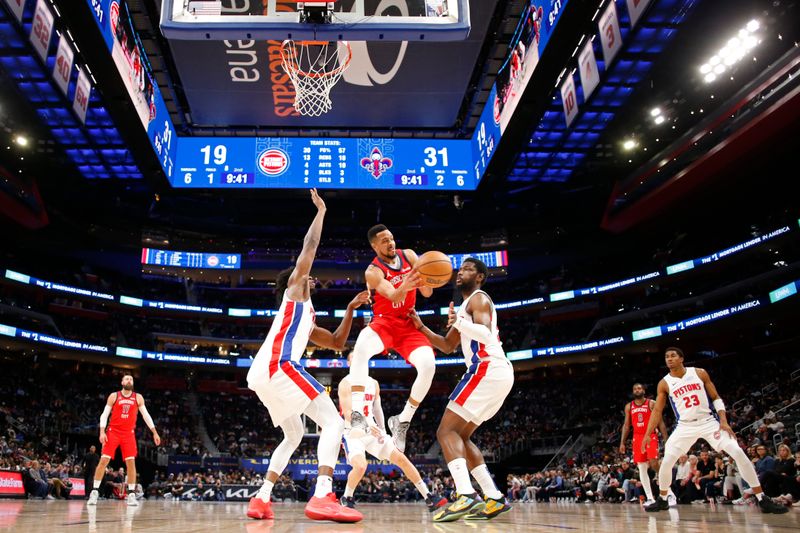 DETROIT, MI - MARCH 24: CJ McCollum #3 of the New Orleans Pelicans passes the ball during the game against the Detroit Pistons on March 24, 2024 at Little Caesars Arena in Detroit, Michigan. NOTE TO USER: User expressly acknowledges and agrees that, by downloading and/or using this photograph, User is consenting to the terms and conditions of the Getty Images License Agreement. Mandatory Copyright Notice: Copyright 2024 NBAE (Photo by Brian Sevald/NBAE via Getty Images)