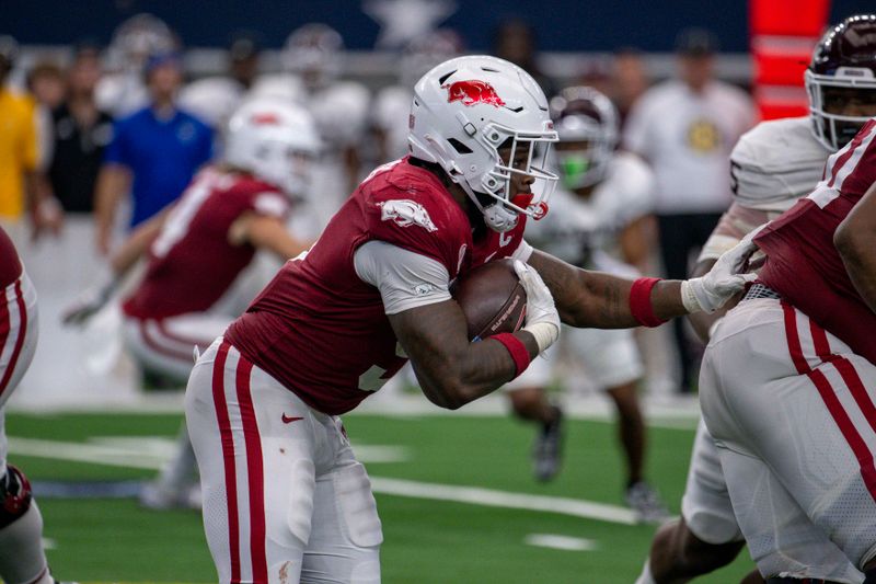 Sep 30, 2023; Arlington, Texas, USA; Arkansas Razorbacks running back Raheim Sanders (5) runs with the ball against the Texas A&M Aggies during the second half at AT&T Stadium. Mandatory Credit: Jerome Miron-USA TODAY Sports