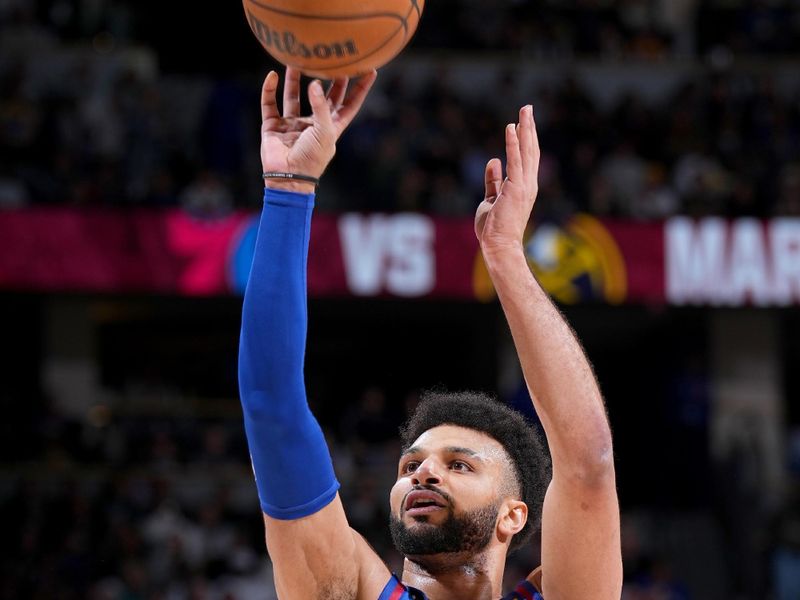 DENVER, CO - MARCH 25: Jamal Murray #27 of the Denver Nuggets shoots a free throw during the game against the Milwaukee Bucks on March 25, 2023 at the Ball Arena in Denver, Colorado. NOTE TO USER: User expressly acknowledges and agrees that, by downloading and/or using this Photograph, user is consenting to the terms and conditions of the Getty Images License Agreement. Mandatory Copyright Notice: Copyright 2023 NBAE (Photo by Garrett Ellwood/NBAE via Getty Images)