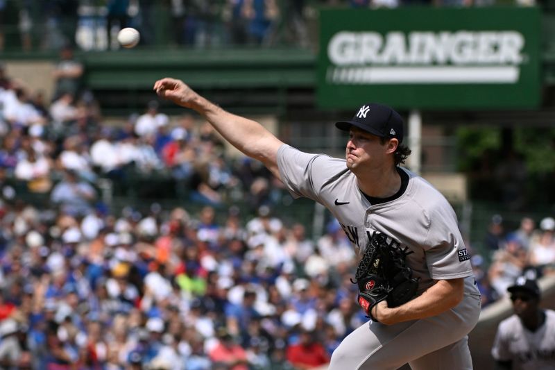 Sep 8, 2024; Chicago, Illinois, USA;  New York Yankees pitcher Gerrit Cole (45) delivers against the Chicago Cubs during the first inning at Wrigley Field. Mandatory Credit: Matt Marton-Imagn Images