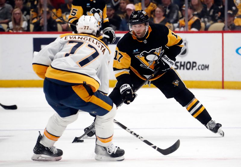 Apr 15, 2024; Pittsburgh, Pennsylvania, USA;  Pittsburgh Penguins right wing Bryan Rust (17) skates up ice with the puck as Nashville Predators right wing Luke Evangelista (77) defends during the third period at PPG Paints Arena. The Penguins won 4-2. Mandatory Credit: Charles LeClaire-USA TODAY Sports