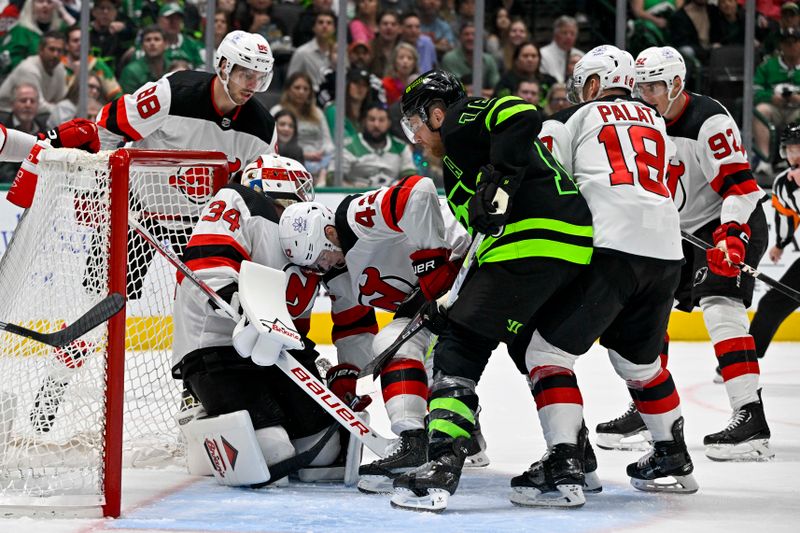 Mar 14, 2024; Dallas, Texas, USA; New Jersey Devils goaltender Jake Allen (34) covers up the puck in front of defenseman Kevin Bahl (88) and center Curtis Lazar (42) and left wing Ondrej Palat (18) and left wing Tomas Nosek (92) and Dallas Stars center Joe Pavelski (16) during the second period at the American Airlines Center. Mandatory Credit: Jerome Miron-USA TODAY Sports