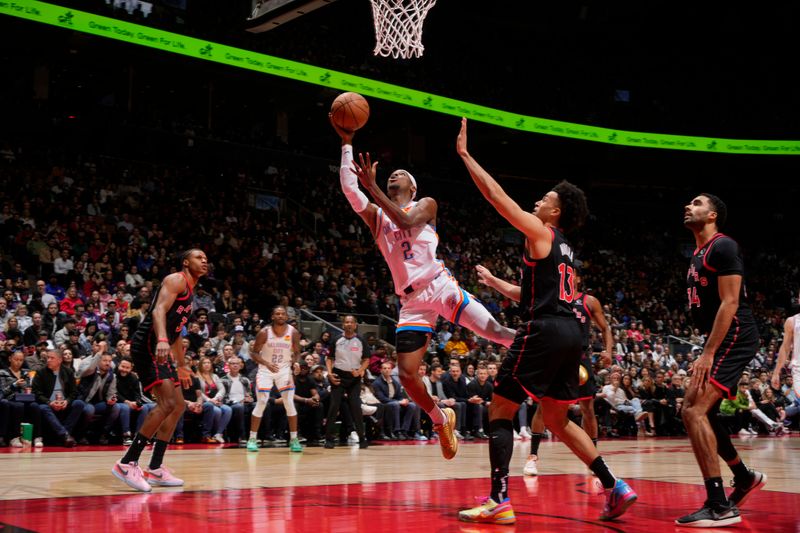 TORONTO, CANADA - MARCH 22:  Shai Gilgeous-Alexander #2 of the Oklahoma City Thunder drives to the basket during the game against the Toronto Raptors on March 22, 2024 at the Scotiabank Arena in Toronto, Ontario, Canada.  NOTE TO USER: User expressly acknowledges and agrees that, by downloading and or using this Photograph, user is consenting to the terms and conditions of the Getty Images License Agreement.  Mandatory Copyright Notice: Copyright 2024 NBAE (Photo by Mark Blinch/NBAE via Getty Images)