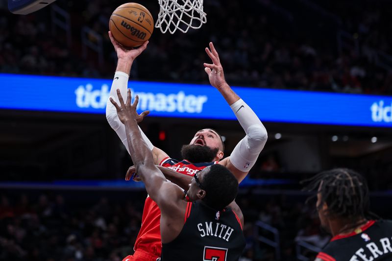 WASHINGTON, DC - JANUARY 01: Jonas Valanciunas #17 of the Washington Wizards shoots the ball against Jalen Smith #7 of the Chicago Bulls during the second half at Capital One Arena on January 1, 2025 in Washington, DC. NOTE TO USER: User expressly acknowledges and agrees that, by downloading and or using this photograph, User is consenting to the terms and conditions of the Getty Images License Agreement. (Photo by Scott Taetsch/Getty Images)