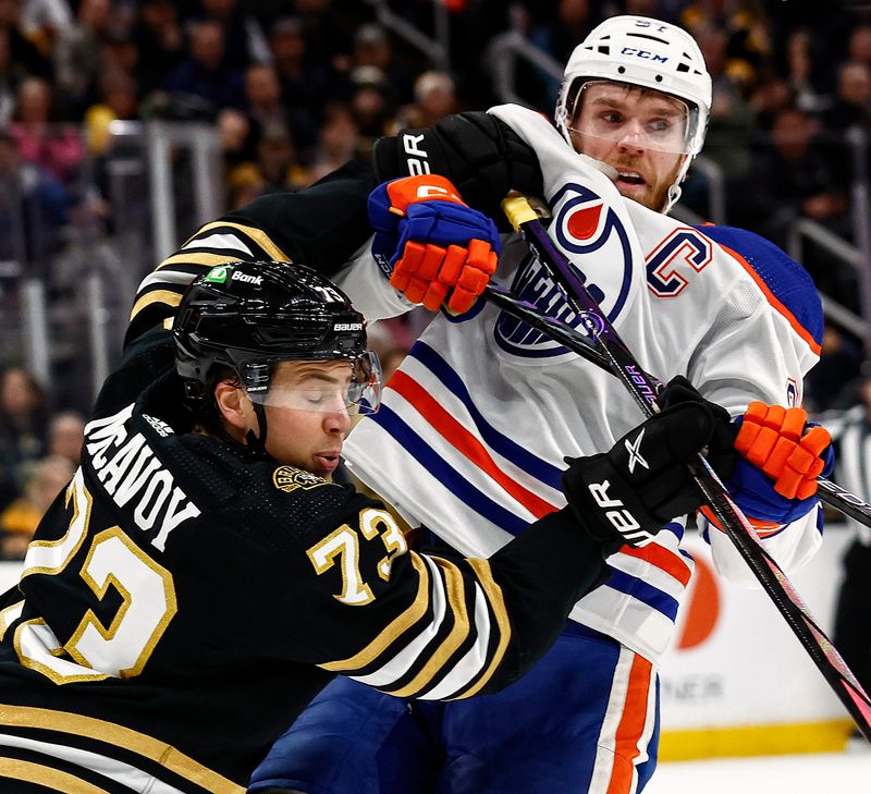 Mar 5, 2024; Boston, Massachusetts, USA; Boston Bruins defenseman Charlie McAvoy (73) stands up Edmonton Oilers center Connor McDavid (97) during the first period at TD Garden. Mandatory Credit: Winslow Townson-USA TODAY Sports