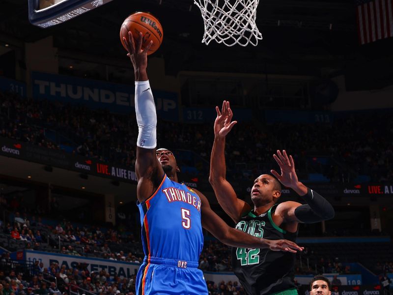 OKLAHOMA CITY, OK - JANUARY 3:  Luguentz Dort #5 of the Oklahoma City Thunder drives to the basket during the game against the Boston Celtics on January 3, 2023 at Paycom Arena in Oklahoma City, Oklahoma. NOTE TO USER: User expressly acknowledges and agrees that, by downloading and or using this photograph, User is consenting to the terms and conditions of the Getty Images License Agreement. Mandatory Copyright Notice: Copyright 2023 NBAE (Photo by Zach Beeker/NBAE via Getty Images)