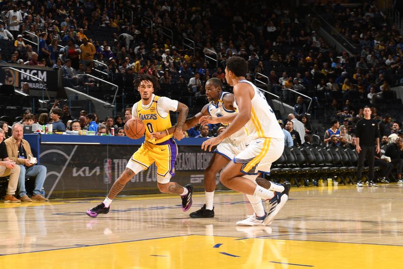 SAN FRANCISCO, CA - OCTOBER 18: Jalen Hood-Schifino #0 of the Los Angeles Lakers handles the ball during the game against the Golden State Warriors during a NBA Preseason game on October 18, 2024 at Chase Center in San Francisco, California. NOTE TO USER: User expressly acknowledges and agrees that, by downloading and or using this photograph, user is consenting to the terms and conditions of Getty Images License Agreement. Mandatory Copyright Notice: Copyright 2024 NBAE (Photo by Noah Graham/NBAE via Getty Images)