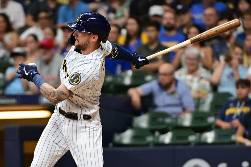 Sep 2, 2023; Milwaukee, Wisconsin, USA;  Milwaukee Brewers second baseman Brice Turang (2) hits a single to drive in a run against the Philadelphia Phillies in the fifth inning at American Family Field. Mandatory Credit: Benny Sieu-USA TODAY Sports