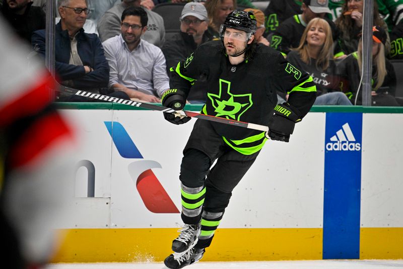 Mar 14, 2024; Dallas, Texas, USA; Dallas Stars defenseman Chris Tanev (3) skates against the New Jersey Devils during the second period at the American Airlines Center. Mandatory Credit: Jerome Miron-USA TODAY Sports