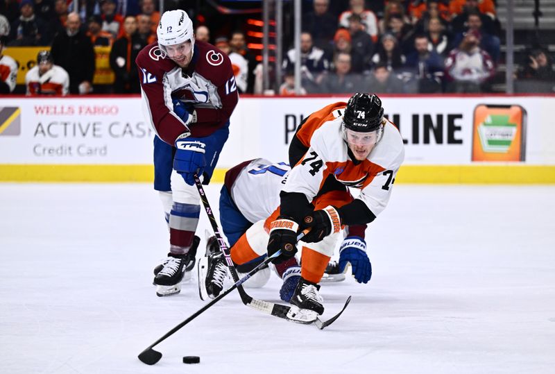 Jan 20, 2024; Philadelphia, Pennsylvania, USA; Philadelphia Flyers right wing Owen Tippett (74) reaches for the puck against Colorado Avalanche center Ryan Johansen (12) in the second period at Wells Fargo Center. Mandatory Credit: Kyle Ross-USA TODAY Sports