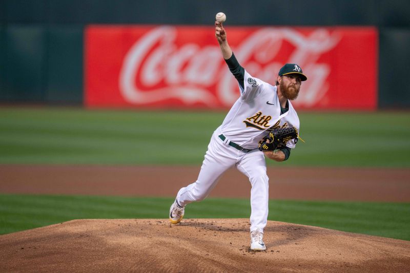 Sep 19, 2023; Oakland, California, USA; Oakland Athletics starting pitcher Paul Blackburn (58) delivers a pitch against the Seattle Mariners during the first inning at Oakland-Alameda County Coliseum. Mandatory Credit: Neville E. Guard-USA TODAY Sports