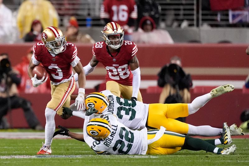 San Francisco 49ers' Ray-Ray McCloud III (3) runs against Green Bay Packers' Robert Rochell (22) and Anthony Johnson Jr. (36) during the second half of an NFL football NFC divisional playoff game Saturday, Jan. 20, 2024, in Santa Clara, Calif. (AP Photo/Godofredo A. Vásquez)