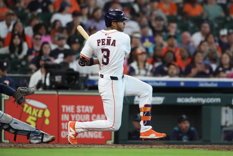 May 24, 2025; Houston, Texas, USA; Houston Astros shortstop Jeremy Pena (3) hits a single during the fourth inning against the Seattle Mariners at Daikin Park. Mandatory Credit: Troy Taormina-Imagn Images