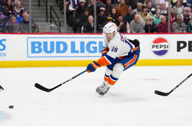 Jan 2, 2024; Denver, Colorado, USA; New York Islanders left wing Pierre Engvall (18) shoots and scores in the first period against the Colorado Avalanche at Ball Arena. Mandatory Credit: Ron Chenoy-USA TODAY Sports