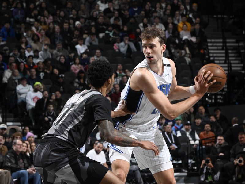 BROOKLYN, NY - DECEMBER 1: Moritz Wagner #21 of the Orlando Magic handles the ball during the game against the Brooklyn Nets on December 1, 2024 at Barclays Center in Brooklyn, New York. NOTE TO USER: User expressly acknowledges and agrees that, by downloading and or using this Photograph, user is consenting to the terms and conditions of the Getty Images License Agreement. Mandatory Copyright Notice: Copyright 2024 NBAE (Photo by David Dow/NBAE via Getty Images)