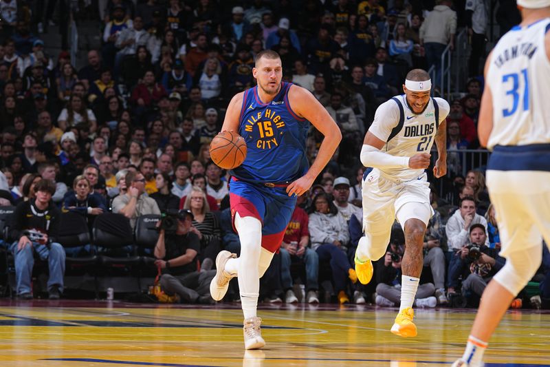 DENVER, CO - NOVEMBER 22:  Nikola Jokic #15 of the Denver Nuggets dribbles the ball during the game against the Dallas Mavericks during the game against the Dallas Mavericks during the Emirates NBA Cup game on November 22, 2024 at Ball Arena in Denver, Colorado. NOTE TO USER: User expressly acknowledges and agrees that, by downloading and/or using this Photograph, user is consenting to the terms and conditions of the Getty Images License Agreement. Mandatory Copyright Notice: Copyright 2024 NBAE (Photo by Bart Young/NBAE via Getty Images)